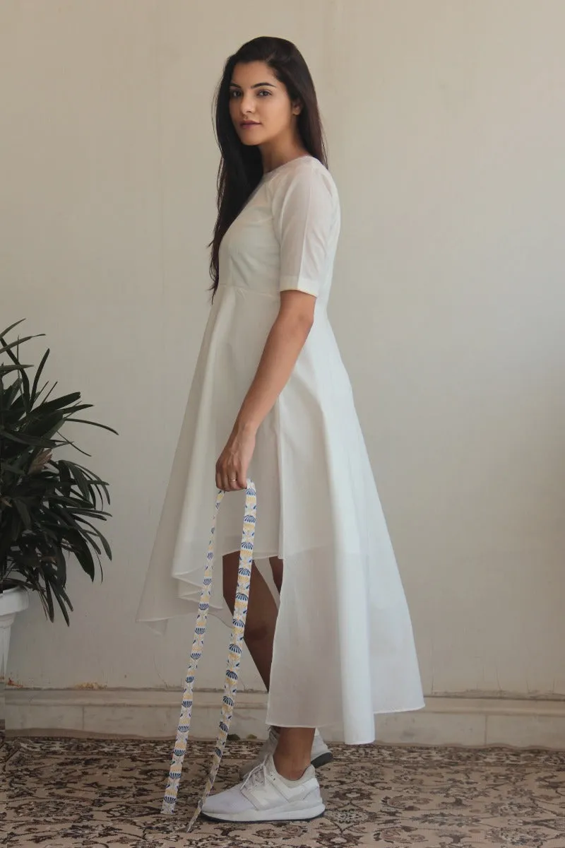 Asymmetric hem full flared cotton dress in White with a printed belt